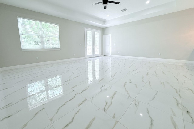 408 E Hanlon St, Tampa, FL 33604 - empty room with french doors, baseboards, marble finish floor, visible vents, and a ceiling fan