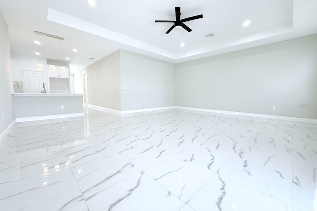 408 E Hanlon St, Tampa, FL 33604 - unfurnished room featuring baseboards, visible vents, a ceiling fan, and a raised ceiling