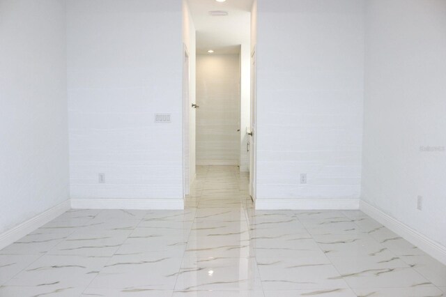 408 E Hanlon St, Tampa, FL 33604 - empty room with marble finish floor and baseboards