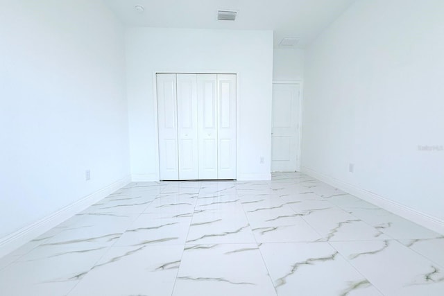 408 E Hanlon St, Tampa, FL 33604 - unfurnished bedroom featuring baseboards, marble finish floor, and visible vents