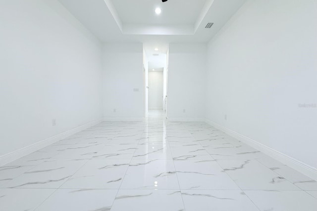 408 E Hanlon St, Tampa, FL 33604 - spare room featuring marble finish floor, baseboards, and a raised ceiling