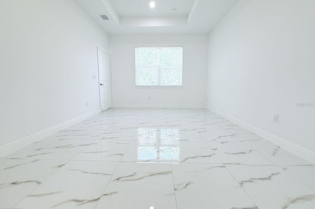 408 E Hanlon St, Tampa, FL 33604 - unfurnished room featuring marble finish floor, a raised ceiling, baseboards, and visible vents