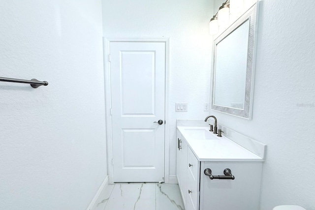 408 E Hanlon St, Tampa, FL 33604 - bathroom featuring marble finish floor, vanity, and baseboards