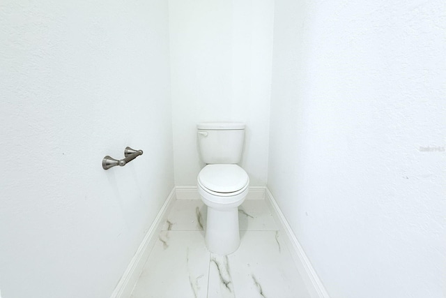 408 E Hanlon St, Tampa, FL 33604 - bathroom with baseboards, marble finish floor, and toilet