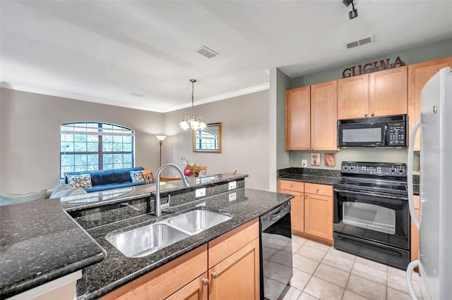 kitchen featuring sink, dark stone counters, a chandelier, light tile patterned flooring, and black appliances