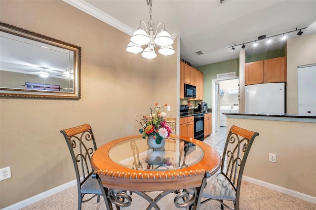 carpeted dining area featuring a notable chandelier and ornamental molding