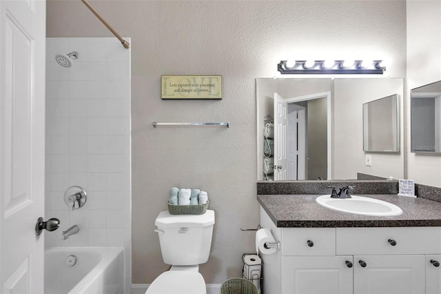 full bathroom featuring vanity, toilet, and tiled shower / bath