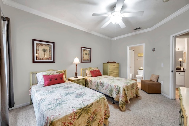 carpeted bedroom featuring ensuite bath, ceiling fan, and ornamental molding