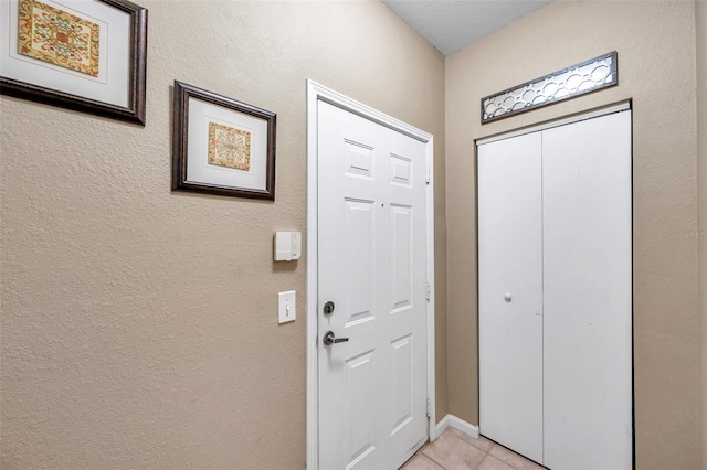 entryway featuring light tile patterned flooring