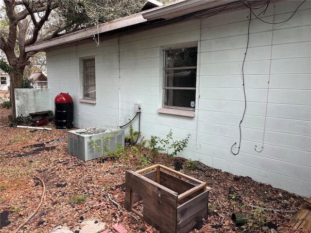 view of property exterior with central AC unit