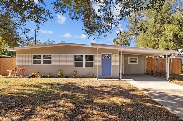 ranch-style house with a carport