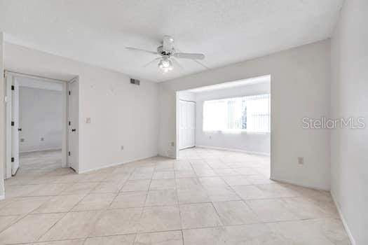 spare room featuring ceiling fan