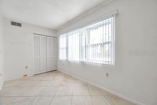 unfurnished bedroom with a closet