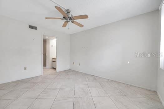 spare room with ceiling fan