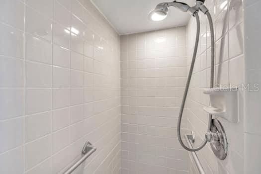 bathroom with a tile shower