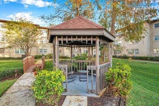 view of community with a gazebo and a lawn