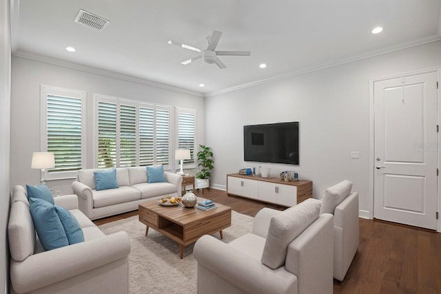 living room with dark hardwood / wood-style floors, ceiling fan, and crown molding