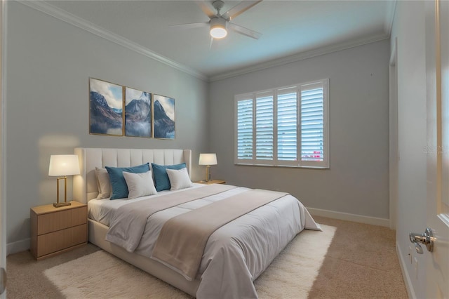 carpeted bedroom with ceiling fan and crown molding