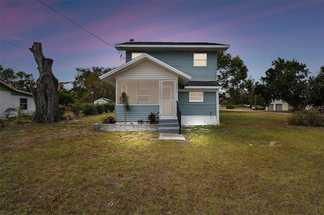 view of front of home featuring a lawn