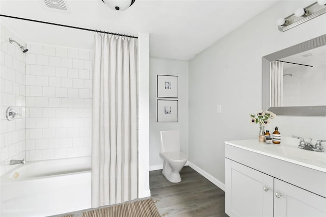 full bathroom with hardwood / wood-style flooring, vanity, toilet, and shower / bath combo