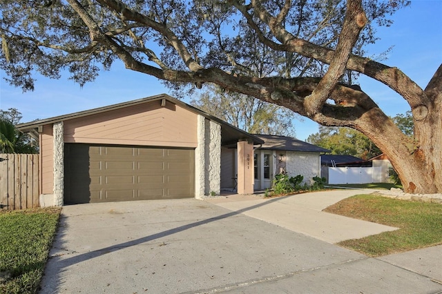 ranch-style home featuring a garage