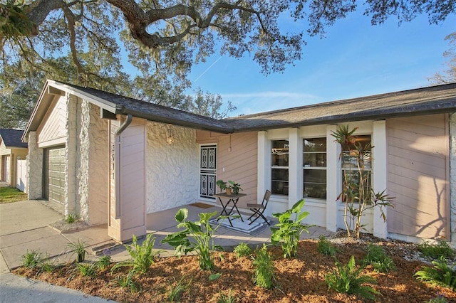 view of side of property featuring a garage