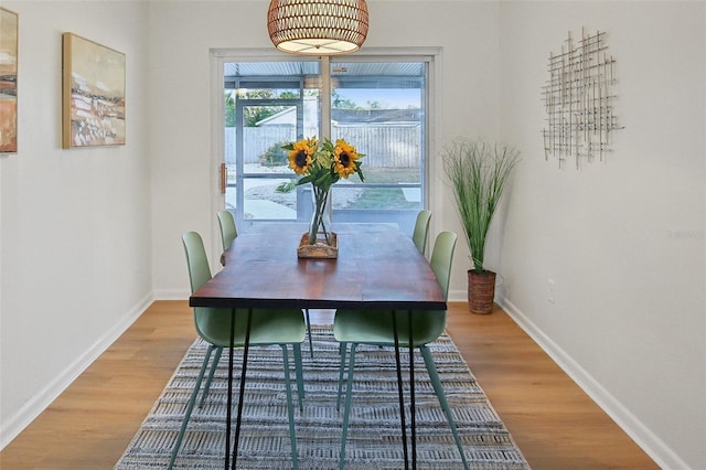 dining space featuring hardwood / wood-style floors