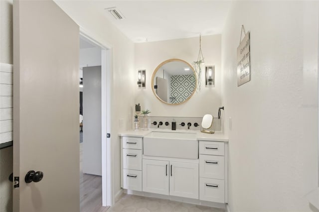 bathroom with vanity and tile patterned floors