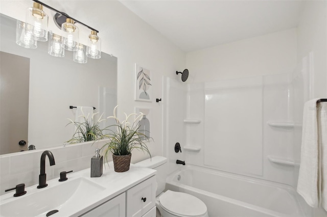 full bathroom with vanity, toilet, washtub / shower combination, and backsplash