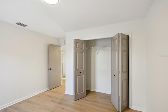 unfurnished bedroom featuring light wood-type flooring