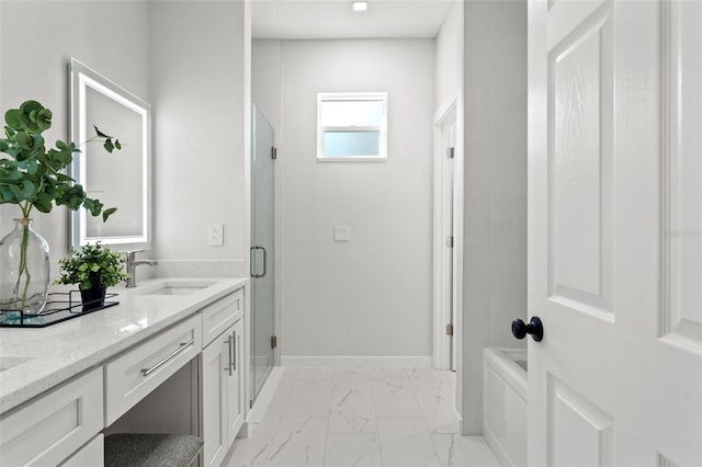 bathroom featuring vanity and a shower with shower door