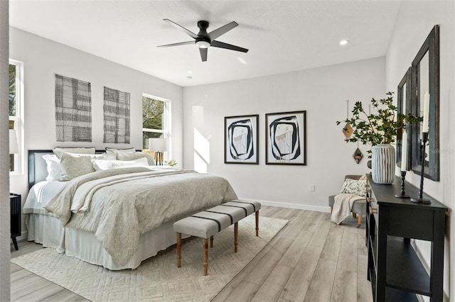 bedroom featuring ceiling fan and light hardwood / wood-style flooring