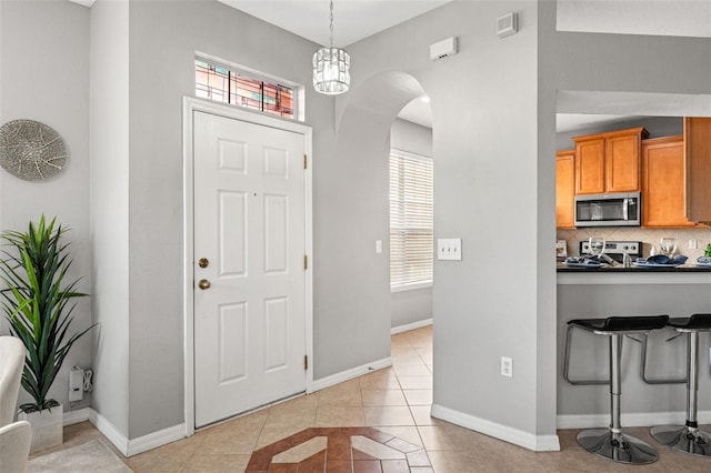 foyer with light tile patterned floors