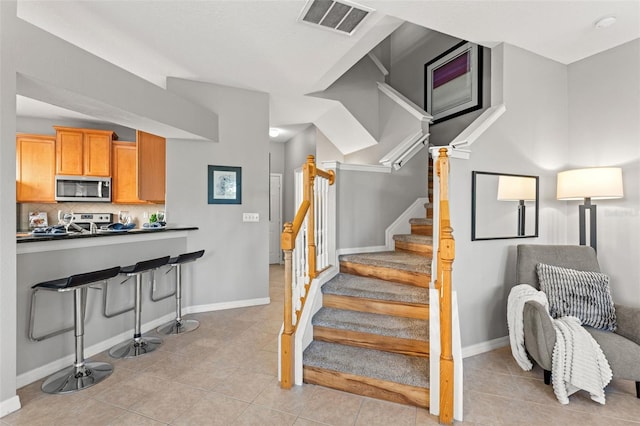 staircase with tile patterned flooring