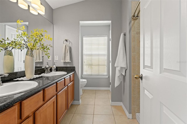 bathroom featuring tile patterned floors, vanity, and toilet