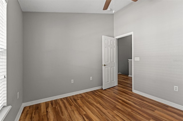 spare room featuring ceiling fan and dark hardwood / wood-style flooring