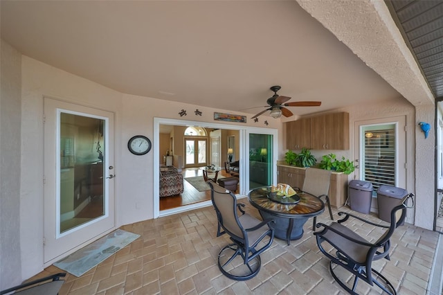 view of patio featuring ceiling fan