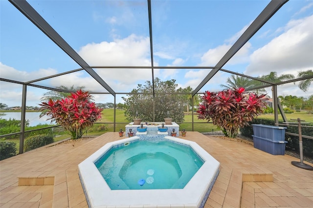 view of swimming pool with glass enclosure, a patio, and an in ground hot tub