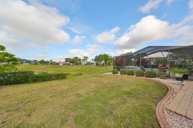 view of yard featuring a lanai