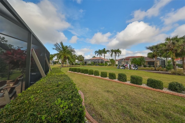 view of yard with a lanai