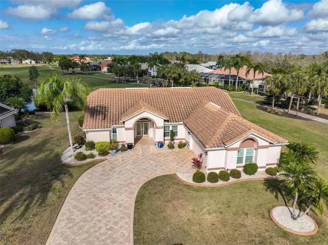 view of front of property with a front lawn and a garage