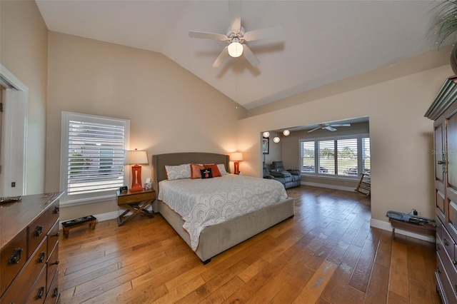 bedroom featuring vaulted ceiling, ceiling fan, and hardwood / wood-style flooring