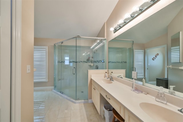 bathroom featuring a shower with door, vanity, and tile patterned flooring