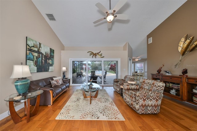 2337 Platinum Dr, Sun City Center, FL 33573 - living room featuring light wood-style floors, high vaulted ceiling, and ceiling fan