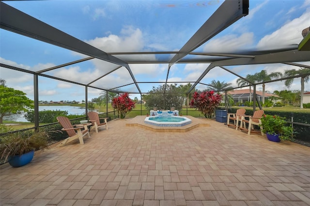2337 Platinum Dr, Sun City Center, FL 33573 - view of patio featuring a water view, a lanai, and a jacuzzi