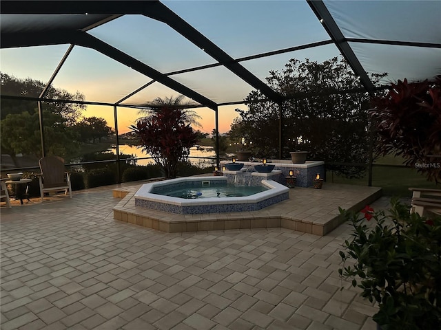 2337 Platinum Dr, Sun City Center, FL 33573 - view of patio featuring glass enclosure and an in ground hot tub