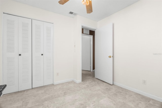 unfurnished bedroom featuring a closet and ceiling fan