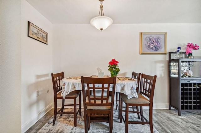 dining area featuring hardwood / wood-style floors