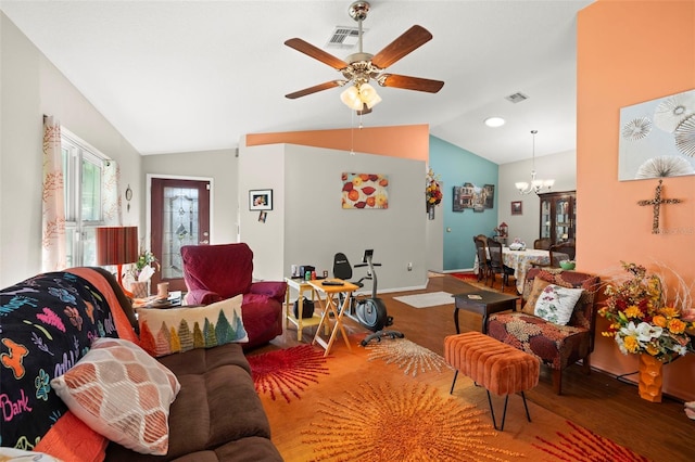 living room featuring hardwood / wood-style floors, ceiling fan with notable chandelier, and lofted ceiling