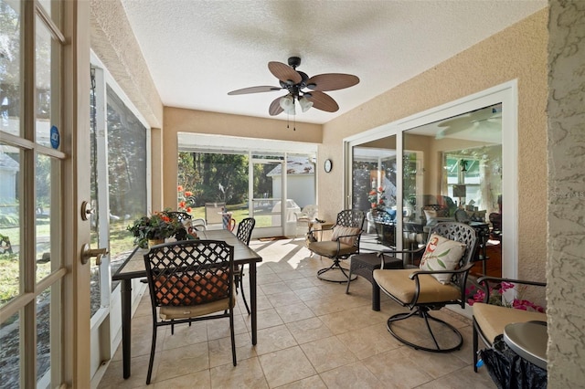 sunroom featuring ceiling fan